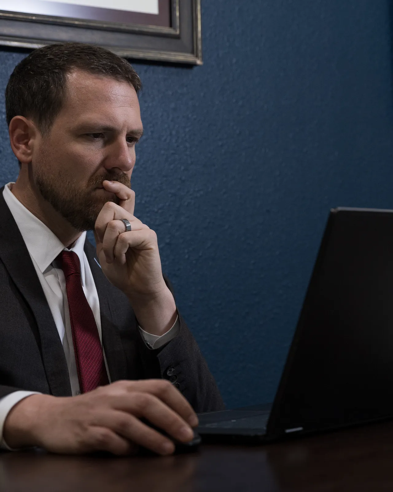 Joe Vrechek reviewing a case at his desk