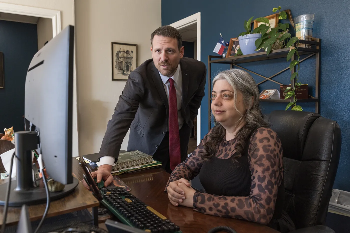 Joe Vrechek working with his legal assistant at the Vrechek Law office