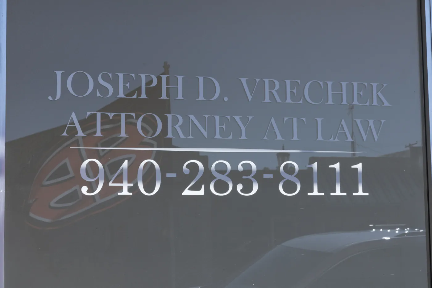 Vrechek Law office door at 313 East 3rd Street in Burkburnett